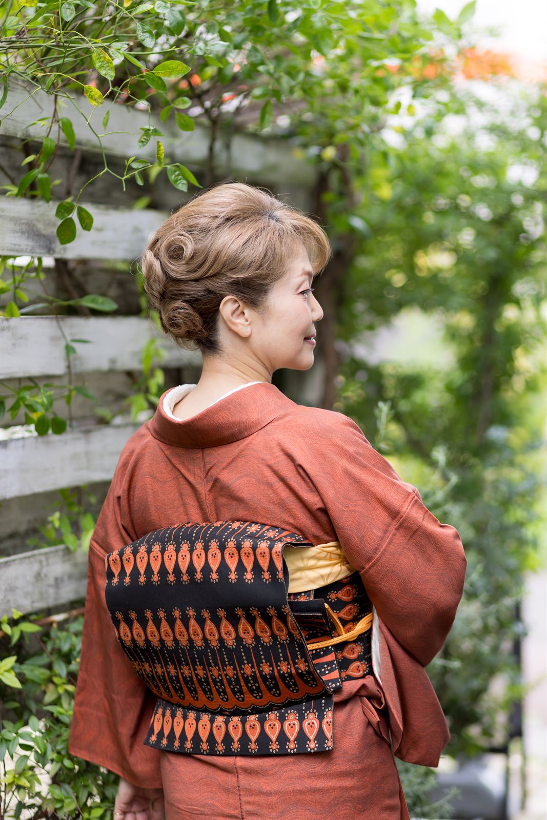 Orange kimono from behind, outdoors