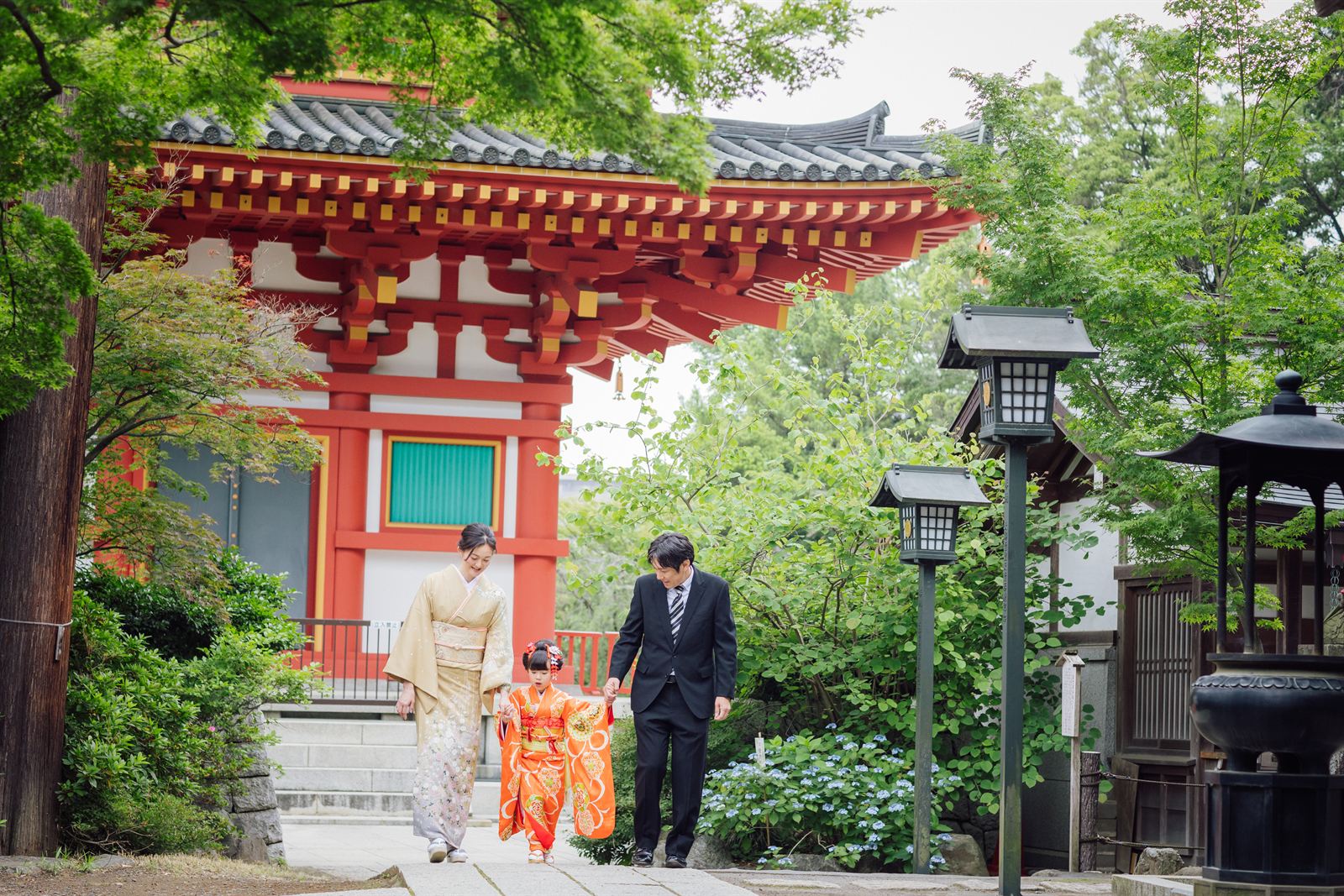 Family walking by the temple gate