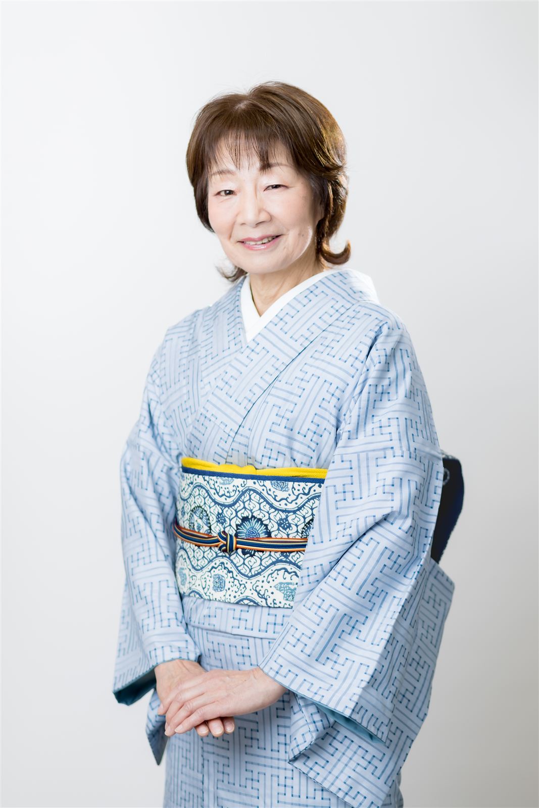 An individual portrait of a woman in kimono
